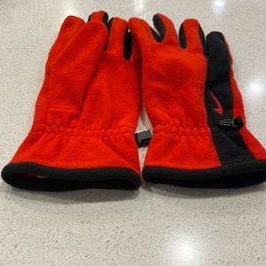 Nike red and black women’s gloves.